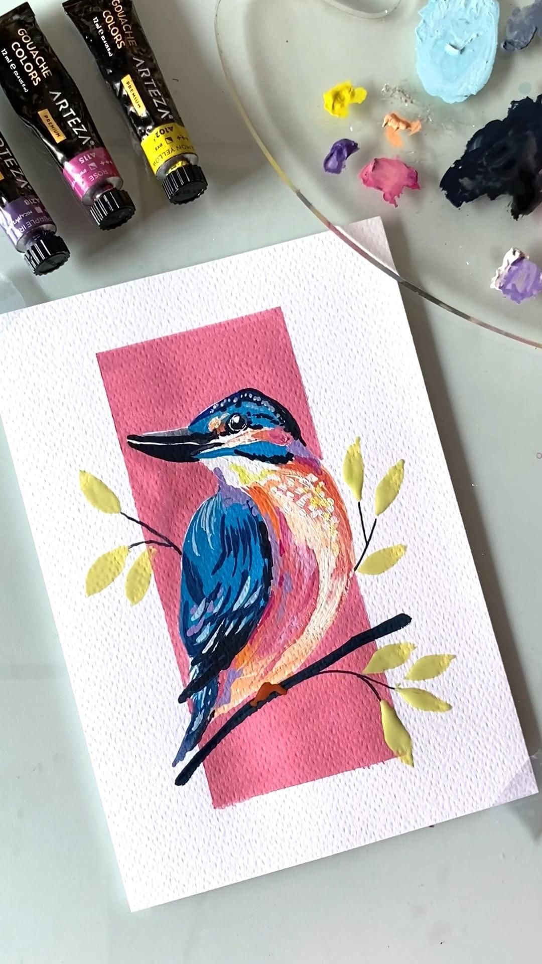 Chú chim bói cá xanh cam đậu trên cành lá vàng, nền khung chữ nhật hồng, vẽ gouache