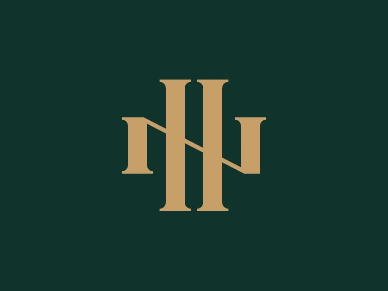 Monogram HN màu vàng đồng trên nền xanh rêu, chữ N có chân serif nằm ngang xuyên qua chữ H cao