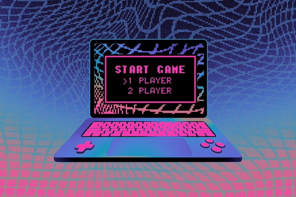 Minh họa chiếc laptop có nút điều khiển như máy chơi game, màn hình chữ pixel START GAME, 1 PLAYER, 2 PLAYER trên nền ô lưới tím hồng