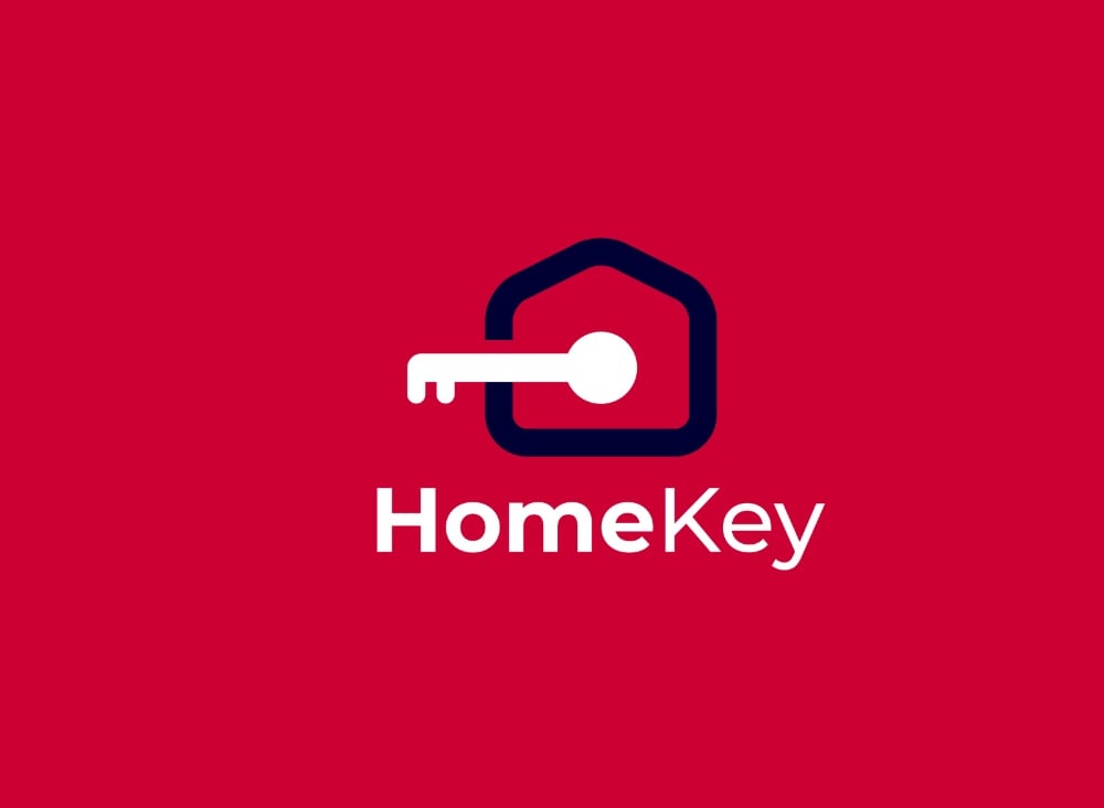 Logo HomeKey: khung ngôi nhà bo góc màu xanh đậm, chìa khoá trắng cắm xuyên qua, nền đỏ